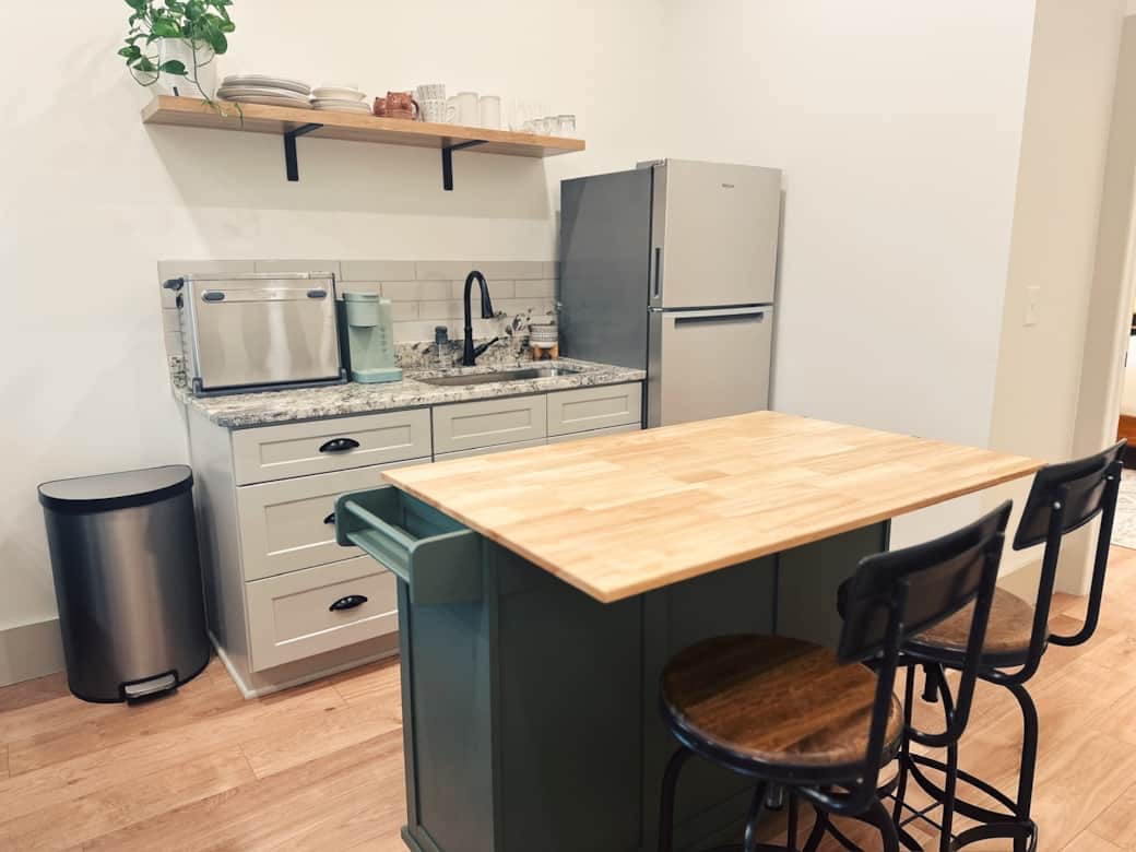 Kitchenette has toaster oven, Keurig, and island for preparing meals and extra seating Kitchenette has toaster oven, Keurig, and island for preparing meals and extra seating