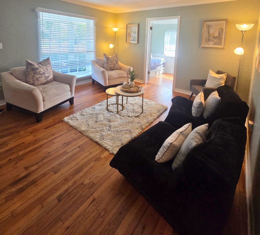 Cozy space with window blinds, center table, and decorative rug. Lakeland, FL Cozy space with window blinds, center table, and decorative rug. Lakeland, FL