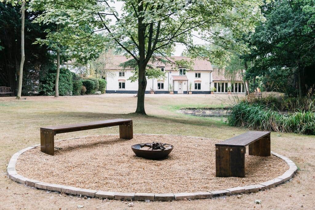 Front of house, pond and fire pit