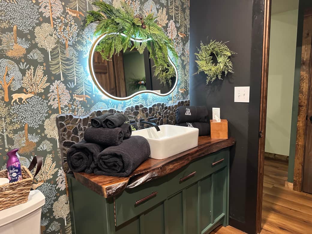 Step into a storybook bath-woodland charm, spa towels, and pure retreat vibes.