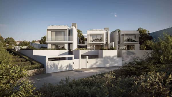 Panoramic view of Olbia's historic yellow streets with mountains in background — photo by RENTAL12
