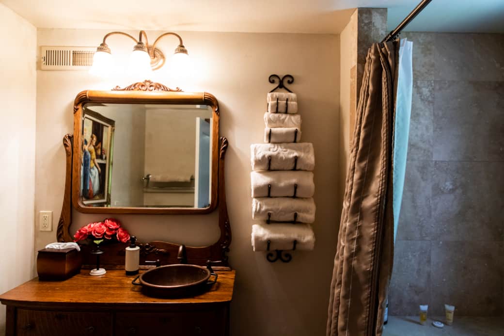 Relax in a private bath with a jetted tub and vintage-inspired vanity Relax in a private bath with a jetted tub and vintage-inspired vanity