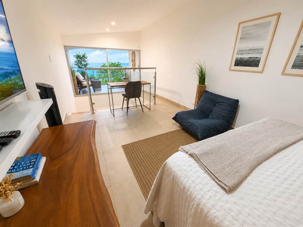 Loft area has a Queen Bed, Comfy Gaming Chair, Desk and Chair to take meetings just steps from the Private 2nd Floor Balcony. The Views are Amazing!