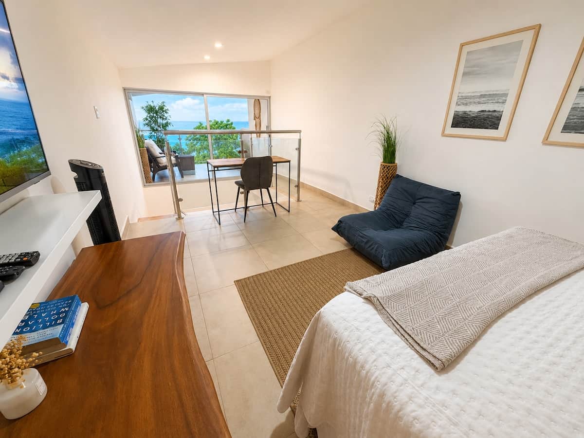 Loft area has a Queen Bed, Comfy Gaming Chair, Desk and Chair to take meetings just steps from the Private 2nd Floor Balcony. The Views are Amazing!