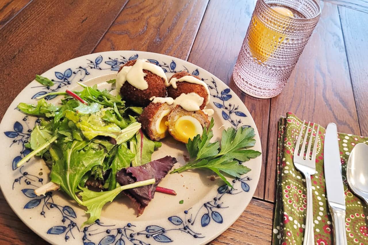 Local Quail Scotch Eggs with Mustard Sauce and Fresh Greens 