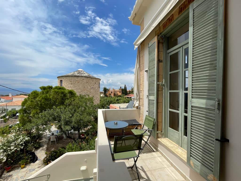 Balcony with view of the sea and wind mill