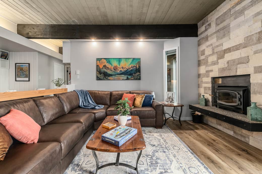 Cozy up by the wood burning fireplace after a day on the mountain