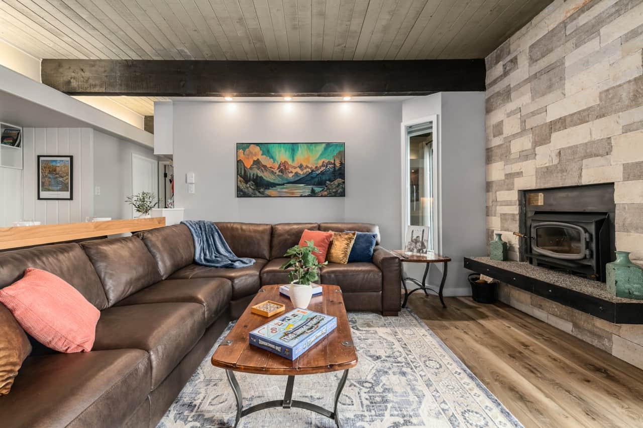 Cozy up by the wood burning fireplace after a day on the mountain