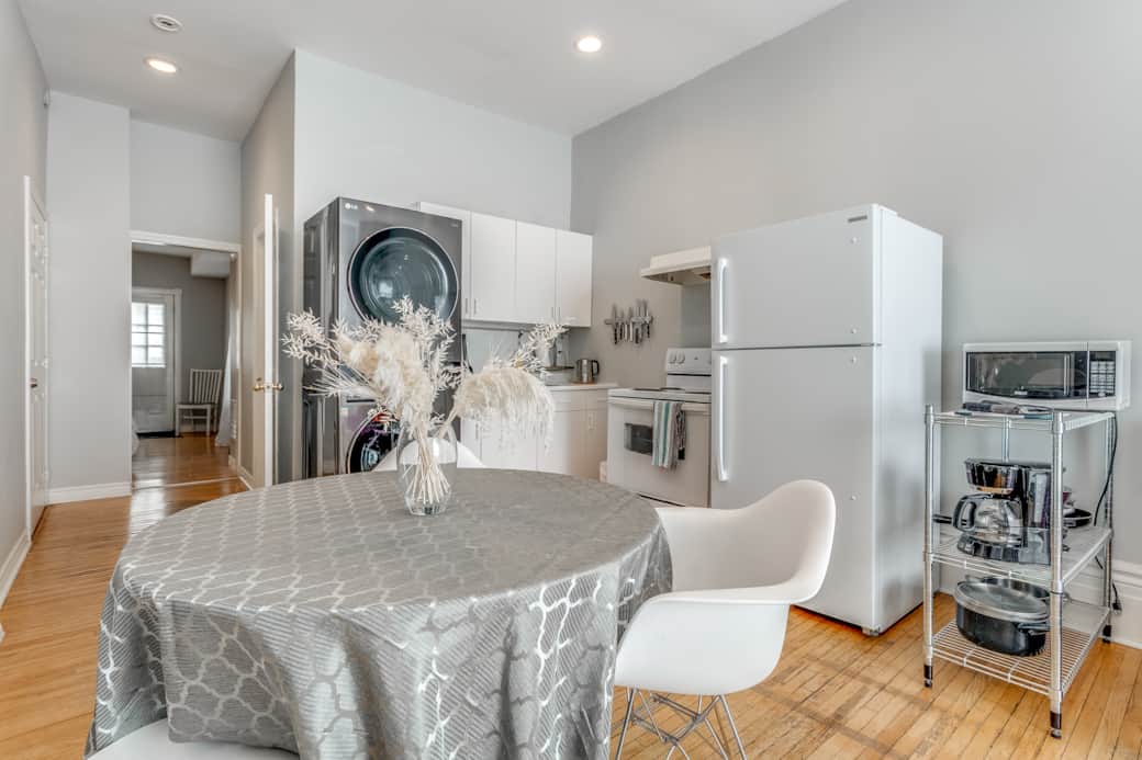 Warm and inviting dining space in a short-term rental, with a compact table set.