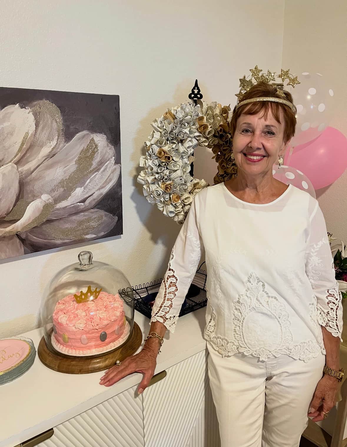 Birthday guest celebrating with custom cake prepared at White Magnolia Galveston