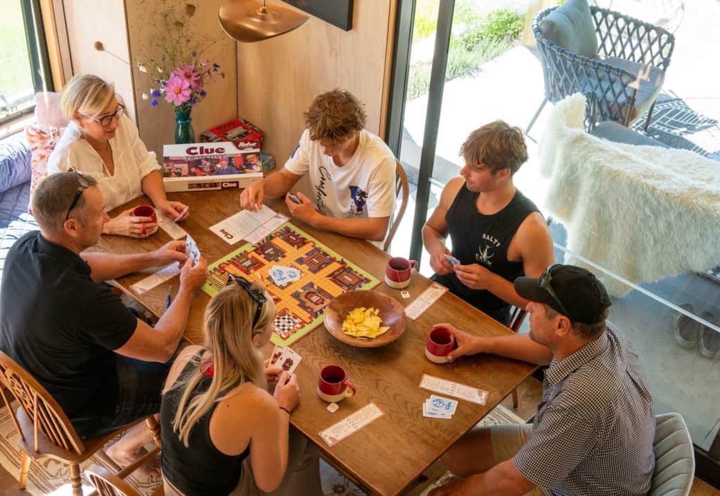 Large family group enjoying breakfast together at Ripples Retreat Waitomo NZ – ideal group and multi