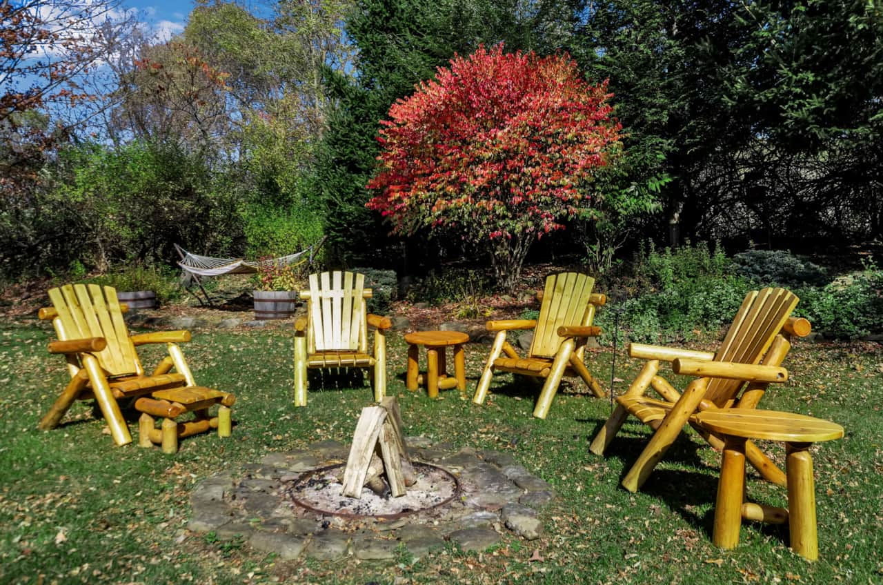 Private backyard with fire pit seating, hot tub, and space for your whole group to gather