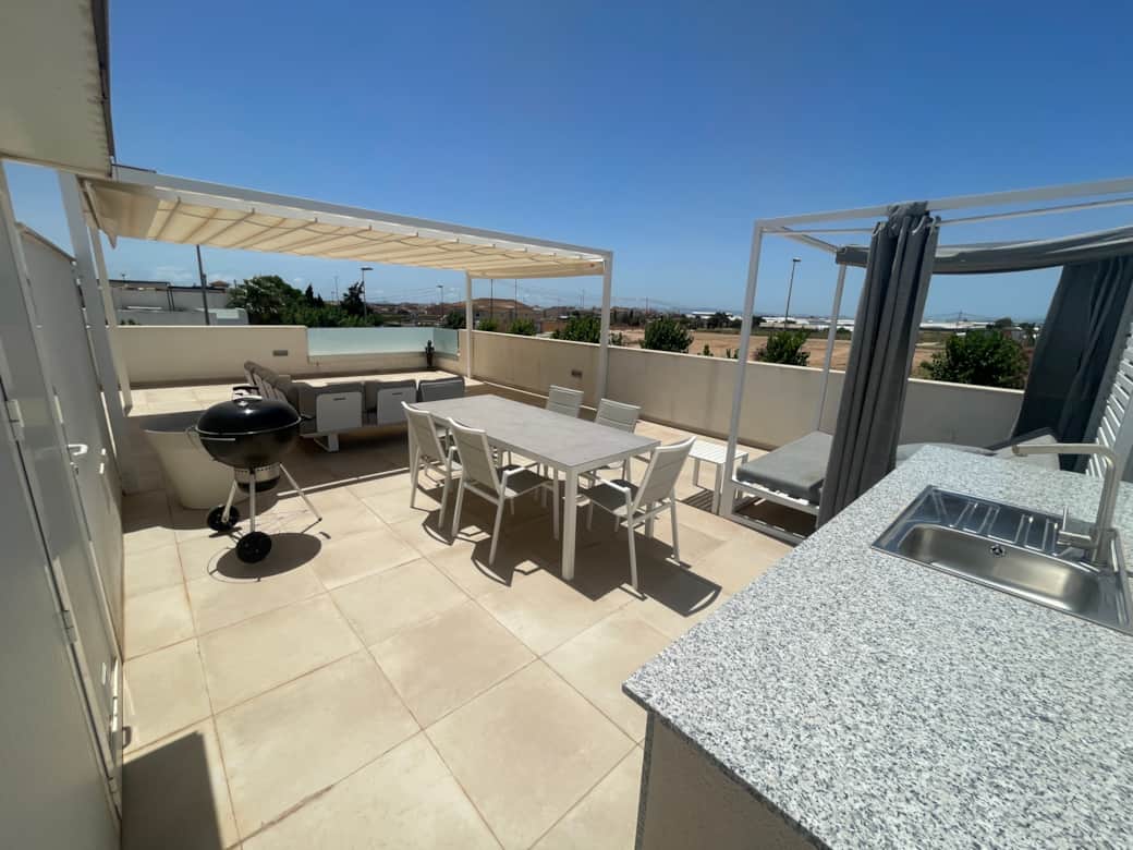 Outdoor kitchen and dining area on the terrace