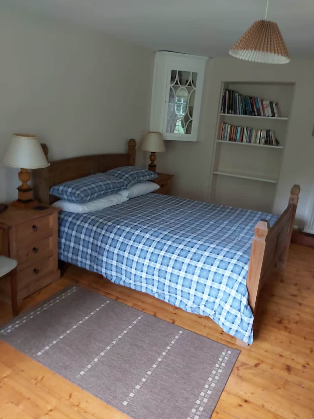 The large double bedroom is on the ground floor of the cottage with dual aspect windows looking out 