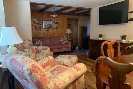Dining/sitting room with a 50" flat screen TV.
