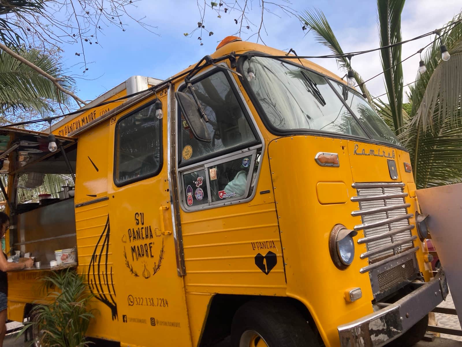 Su Pancha Madre yellow vintage food truck under the palms in San Pancho, Nayarit