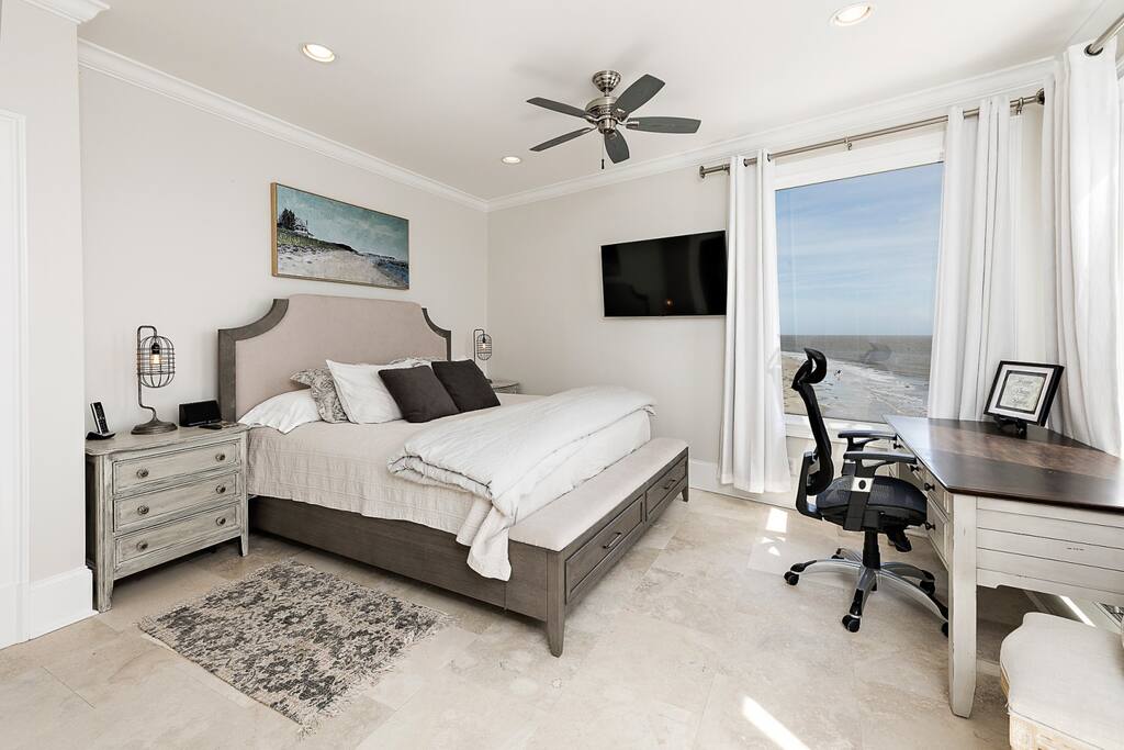 Master bedroom with king bed, amazing views and large workspace located on the fourth floor.