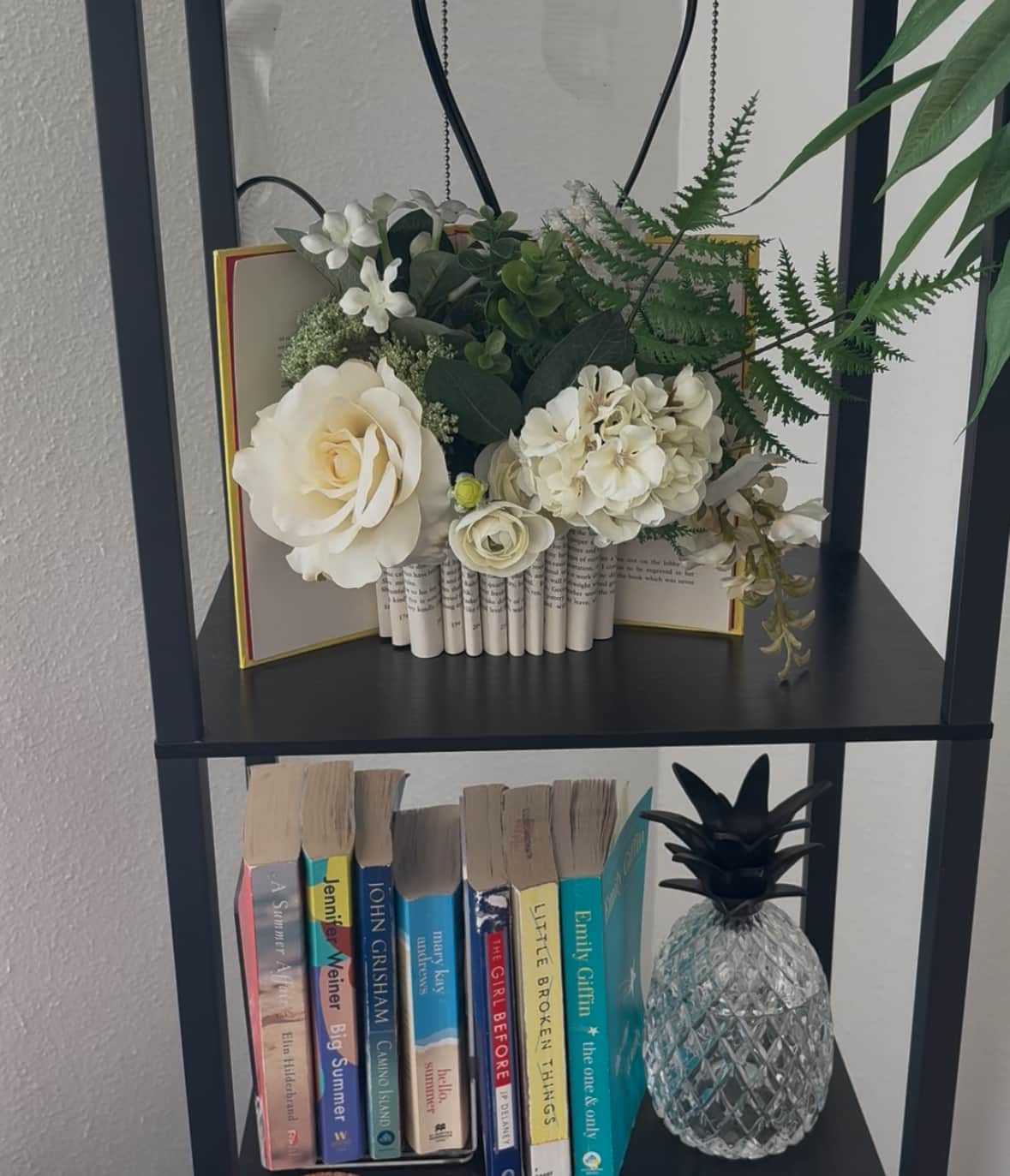 Bookcase with favorite beach reads for guests.