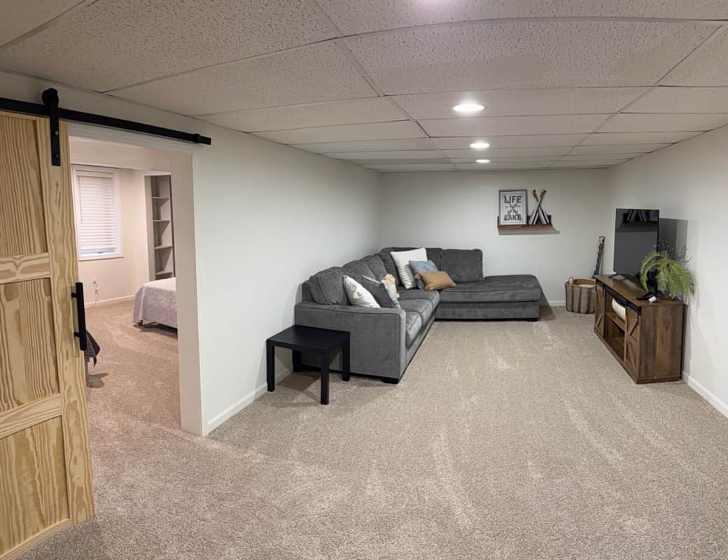 Downstairs living room, with sectional sleeper that pulls out to a queen bed.