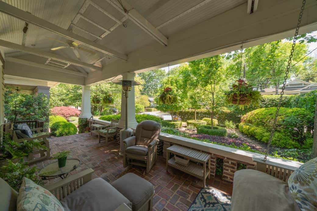 Front porch overlooks a beautifully manicured, private garden Front porch overlooks a beautifully manicured, private garden