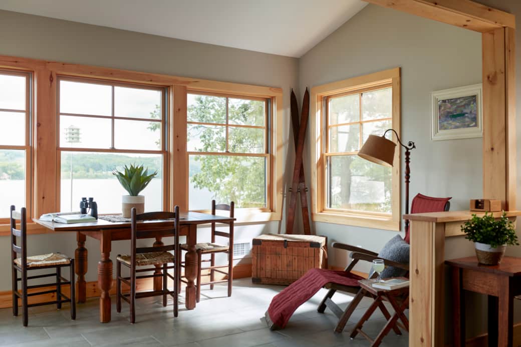 Sunroom with Wall-to-Wall Windows and Access to Lower Deck