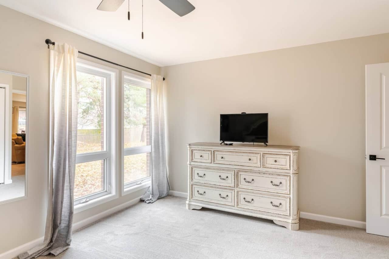 Master bedroom with large window to back yard area