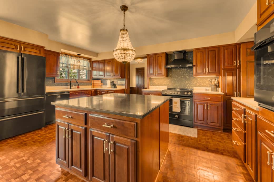 Fully stocked gourmet kitchen with island 