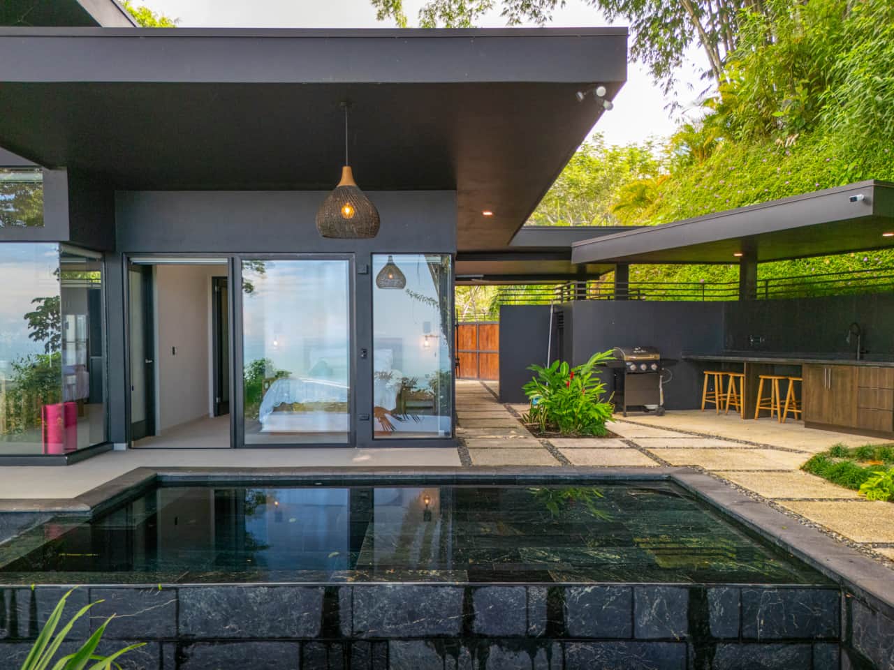 Covered terrace, pool and outdoor BBQ area