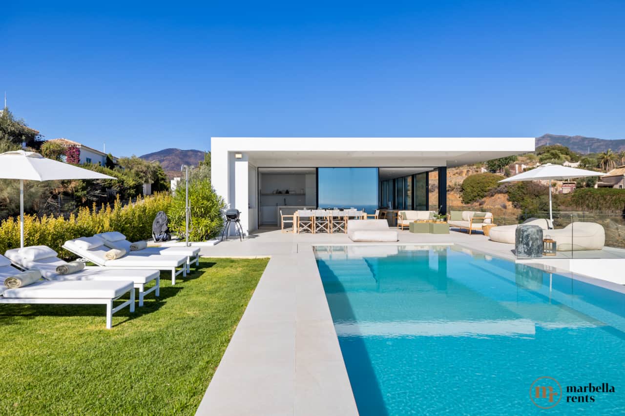 Private swimming pool with sunloungers.