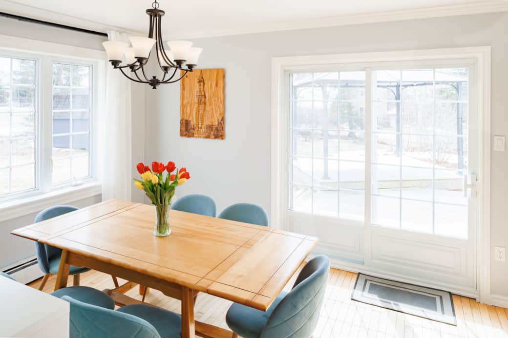Sunlit dining area with seating for six and a fresh, modern feel.