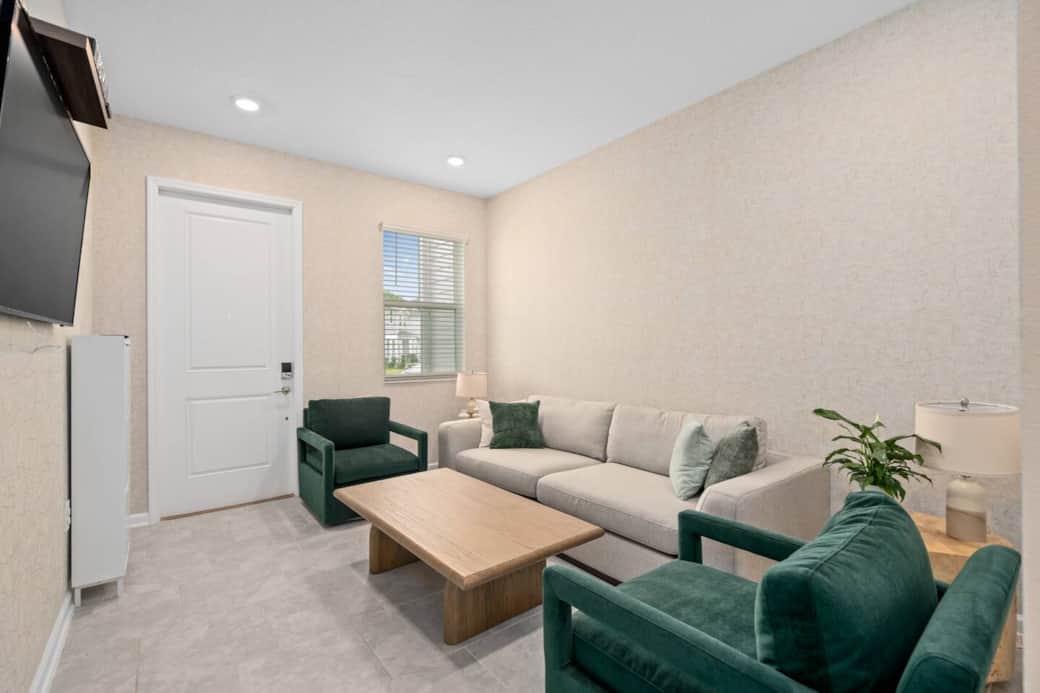 The main entrance opens into a calm and cozy living room designed to reduce overstimulation and help you relax after a long day at the Disney parks. Stay in a sensory-friendly vacation rental near Disney with family-friendly features throughout.