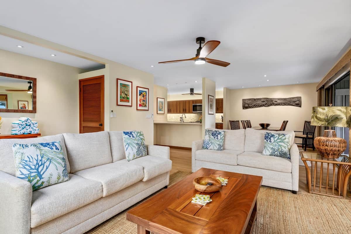 Comfortable living room for relaxing with your family features a new matching couch and sofa/sleeper