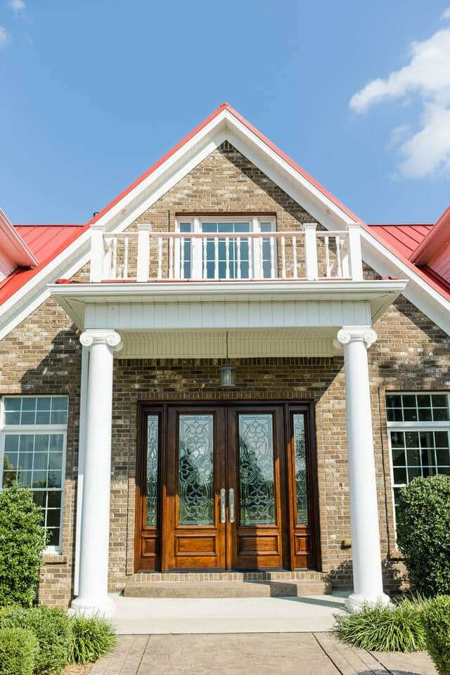 Grand double entry doors with etched glass contribute to the regal entrance. Grand double entry doors with etched glass contribute to the regal entrance.