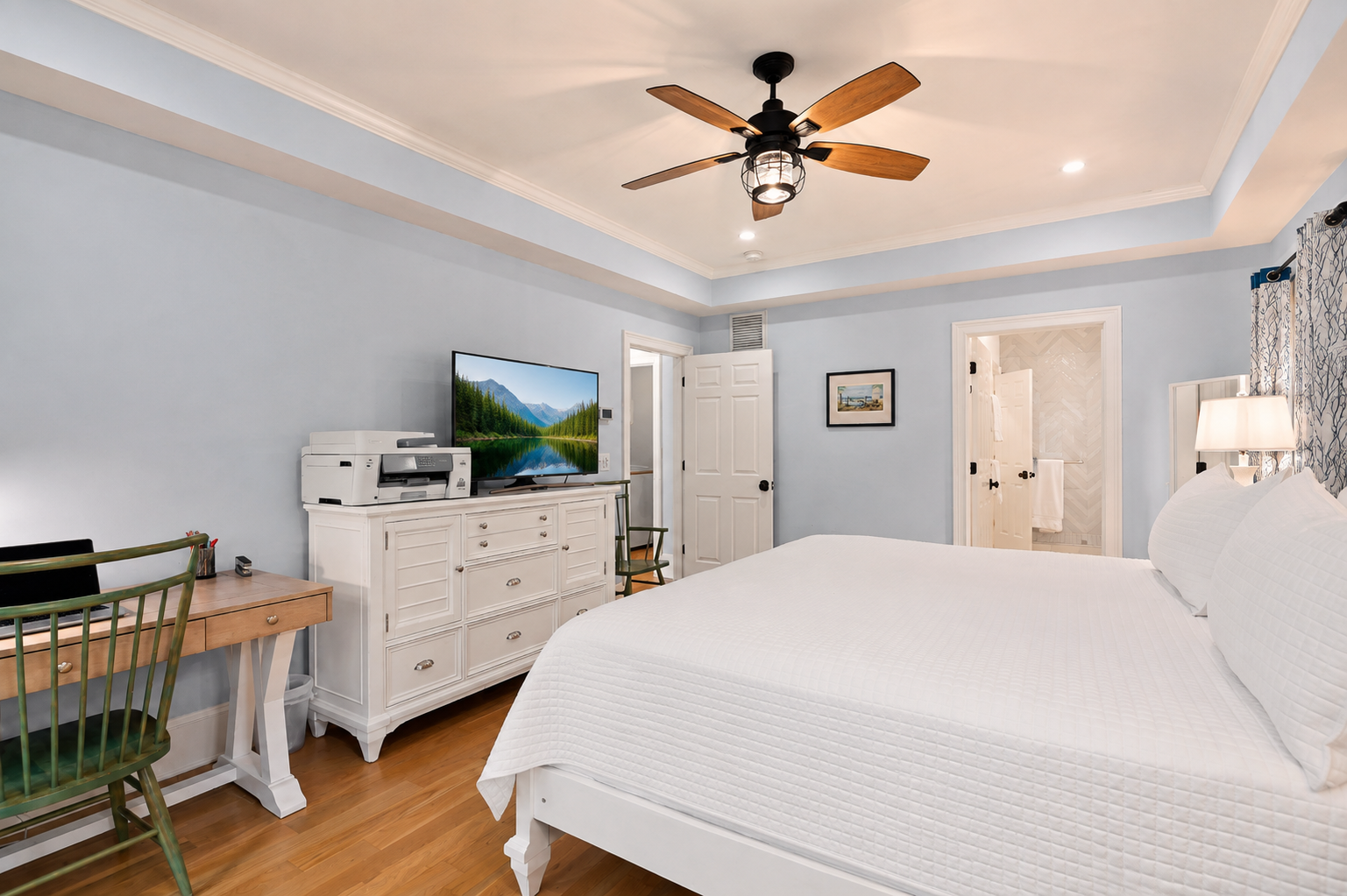 Get ready in the ensuite bath or catch up on work at the wooden desk.
