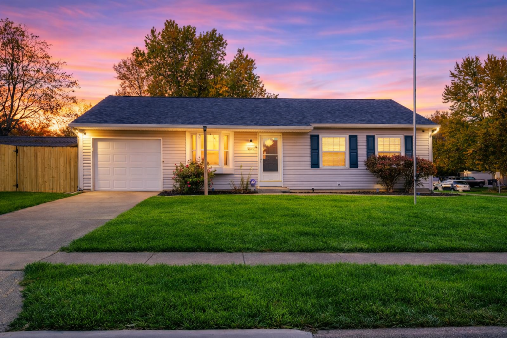 Escape to this three-bedroom ranch house, featuring a fenced backyard, hot tub and game shed