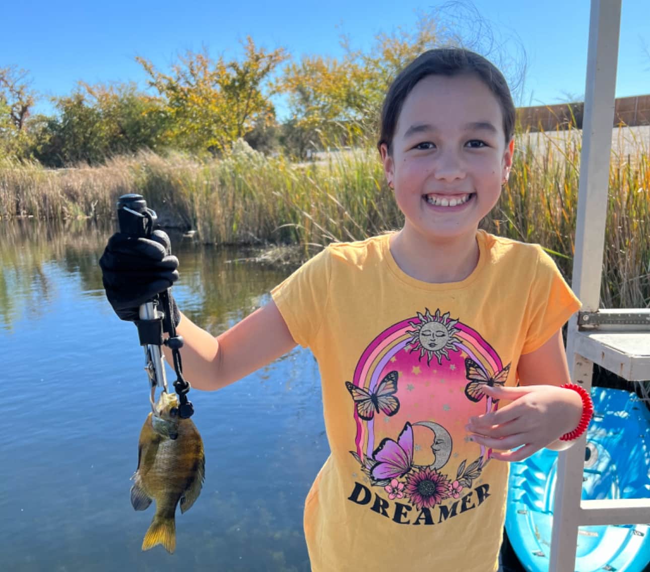 Family fishing at the serene Beaver Pond on Lake Godstone with easy shoreline and dock access