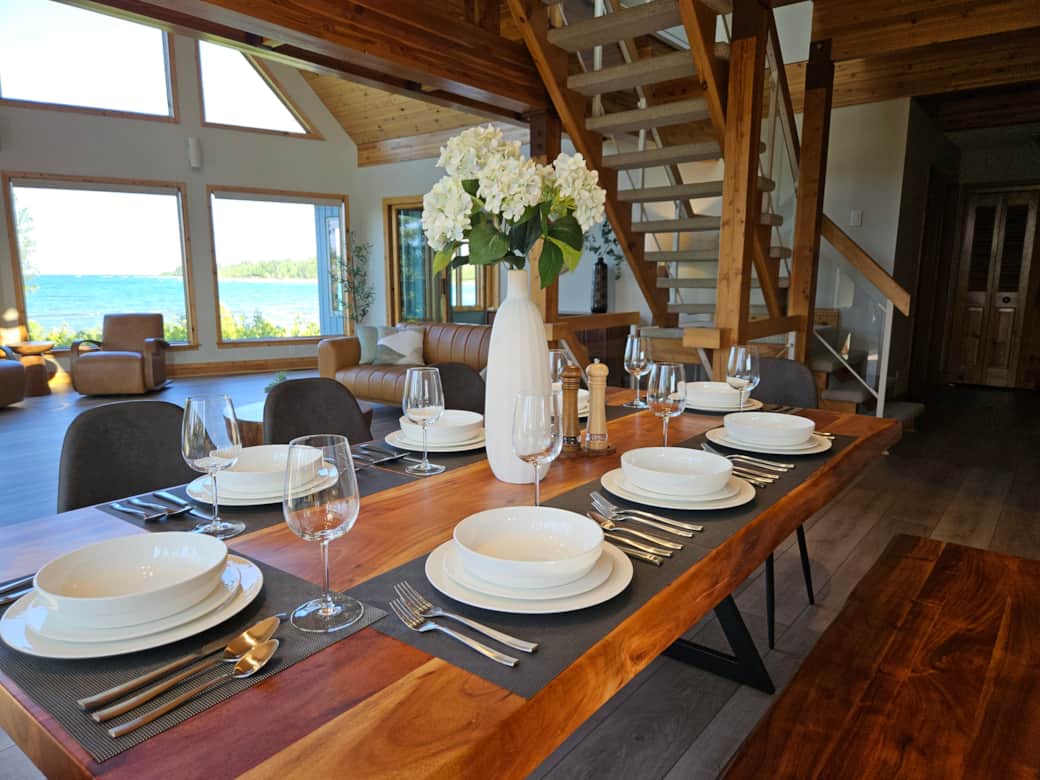 Dining table comfortably sits 8. Dinnerware, glassware and silverware are provided at the cottage.