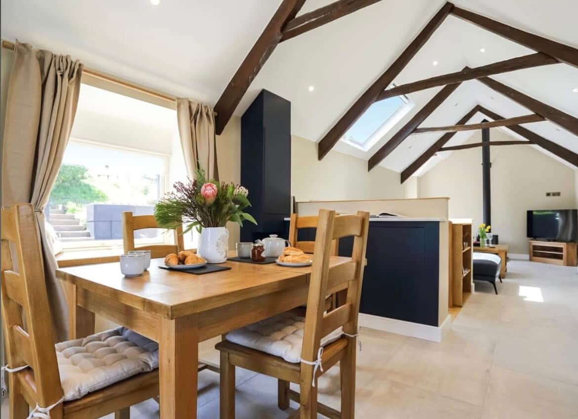 Four person dining table, that can extend to six for additional comfort, with blue tooth speaker and lamp to create the perfect evening in.