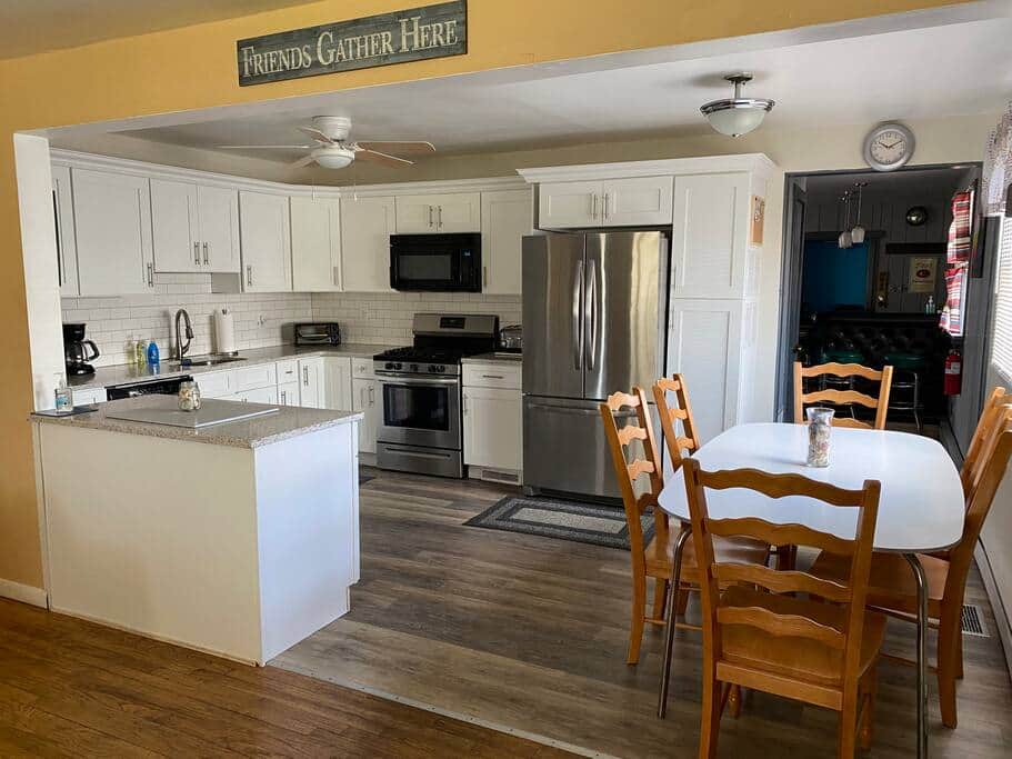 Fully stocked kitchen with stove, fridge, microwave, dishwasher, keurig, toaster etc.