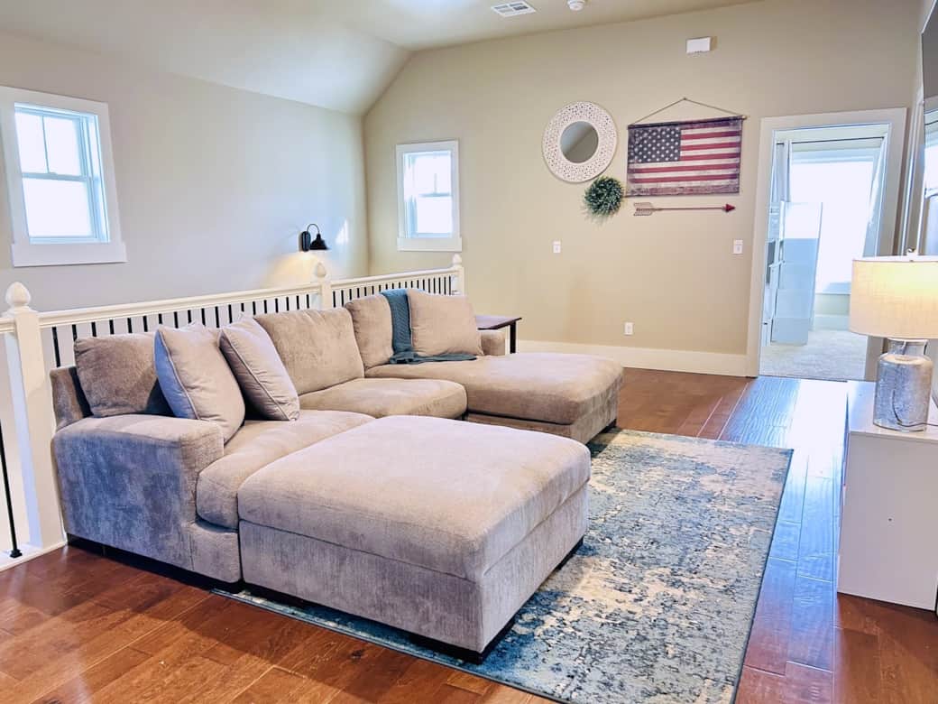 The game loft hosts a 75" TV and plenty of space for the family to play.