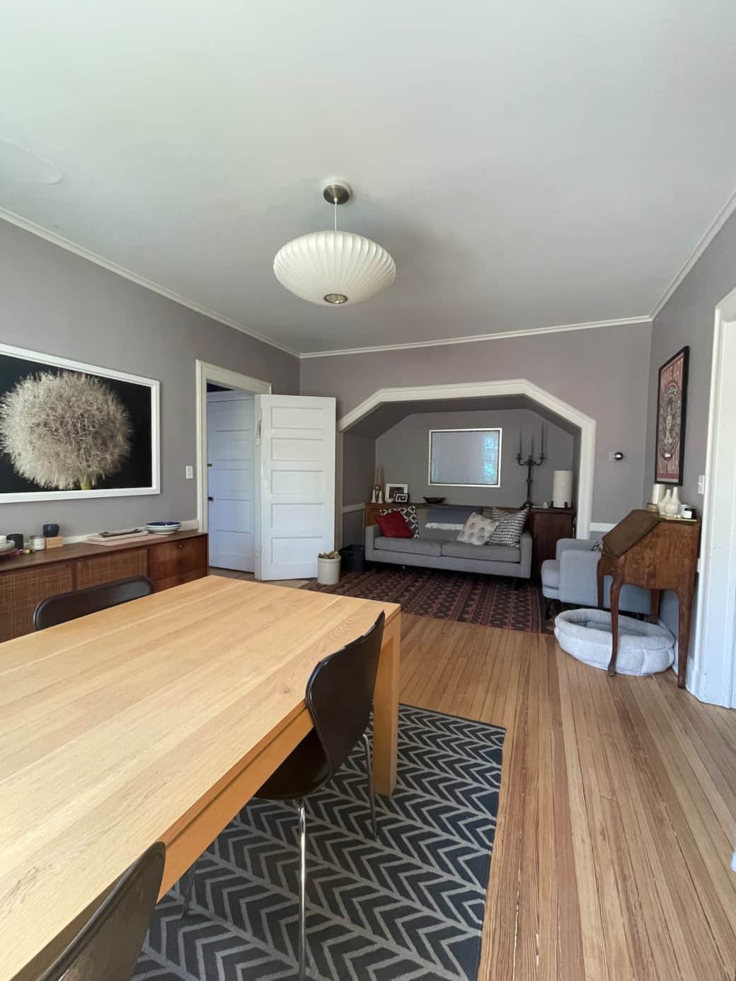 Dining room table and sitting nook (underneath two separate staircases).
