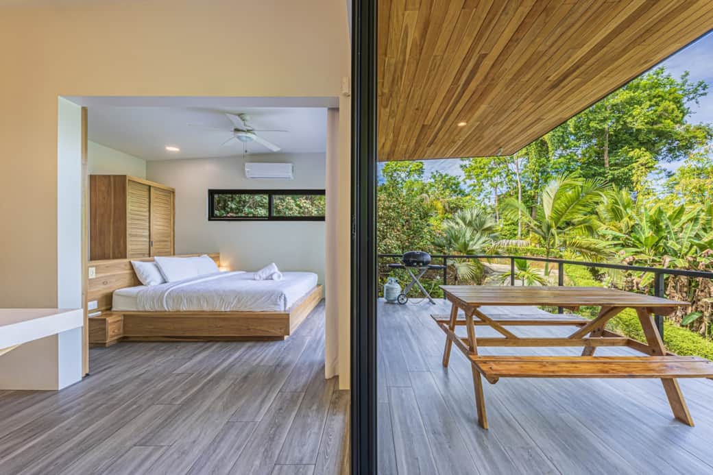 King bed with views of the patio and jungle