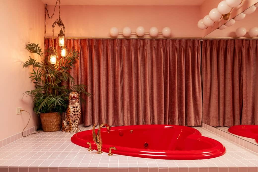 Heart-shaped jacuzzi tub in a vintage-inspired bathroom