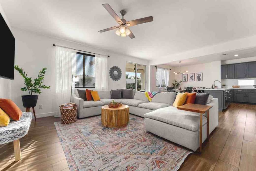 living room area with super comfy sectional couch and wall mounted, 65 in 4K TV living room area with super comfy sectional couch and wall mounted, 65 in 4K TV