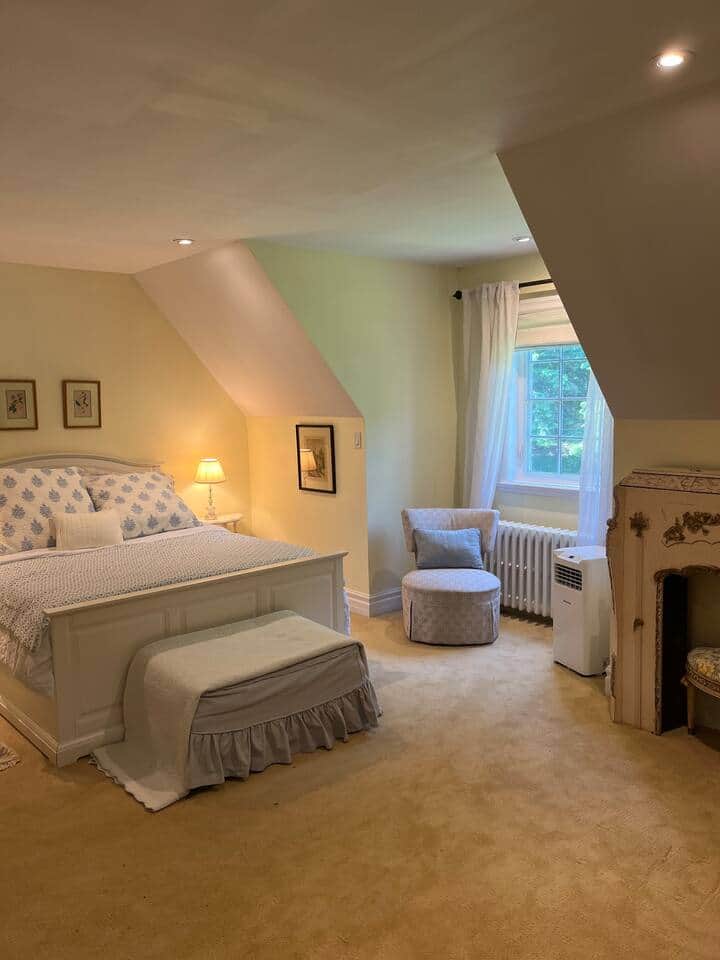 The Garden Bedroom Suite overlooking a beautiful perennial garden. Air conditioned.  Keyed lockable privacy door. Full bathroom. Armoire.