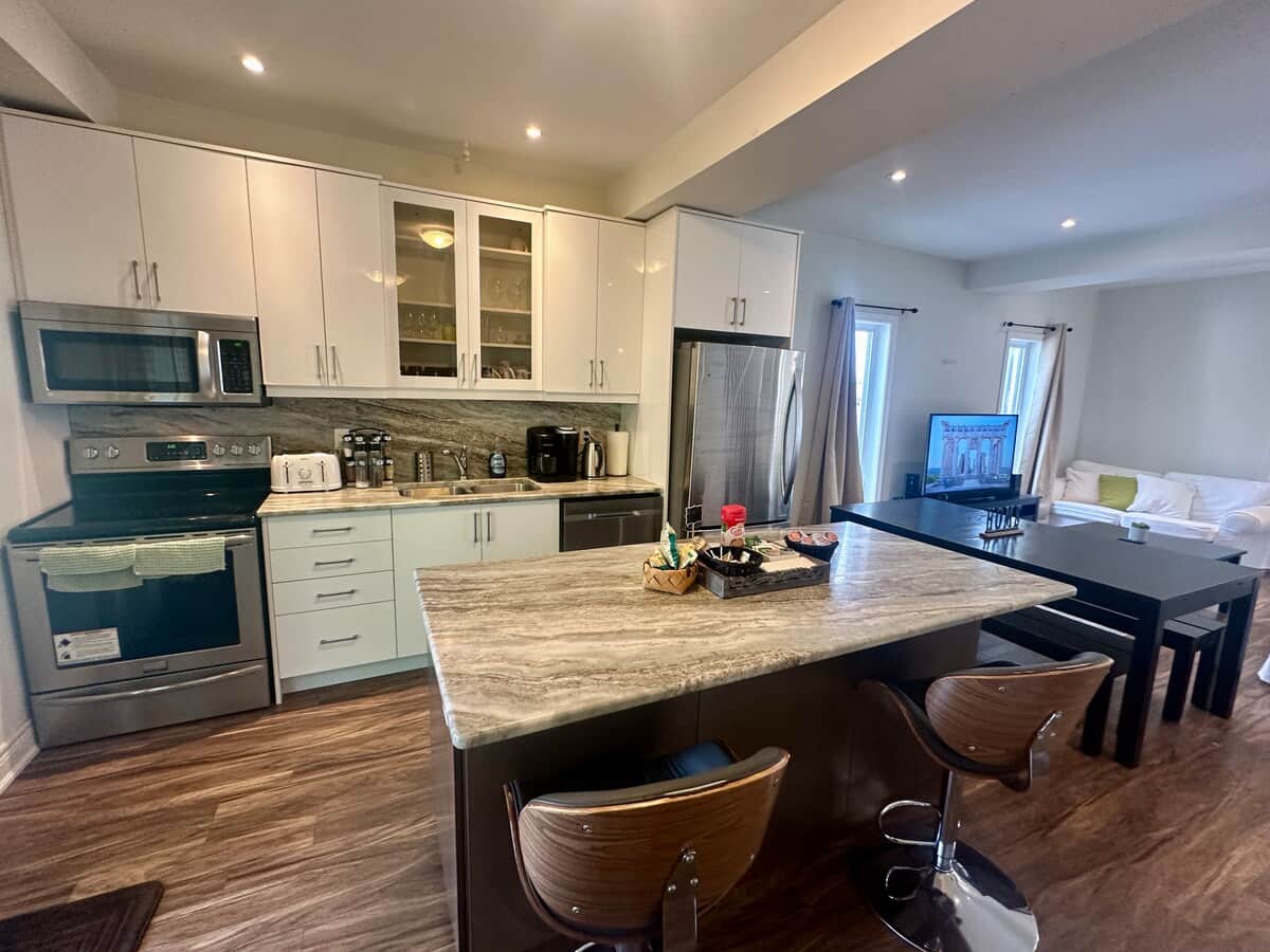 Kitchen w/ Fridge, Stove, Microwave, Dishwasher, Coffee Maker, Toaster, Kettle, complementary coffee, tea, snacks.