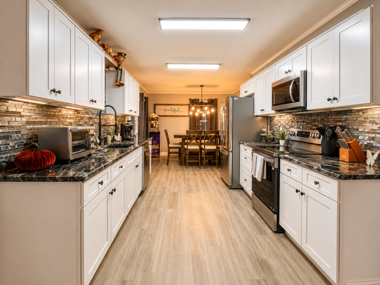 A brand new, fully stocked galley kitchen with granite countertops