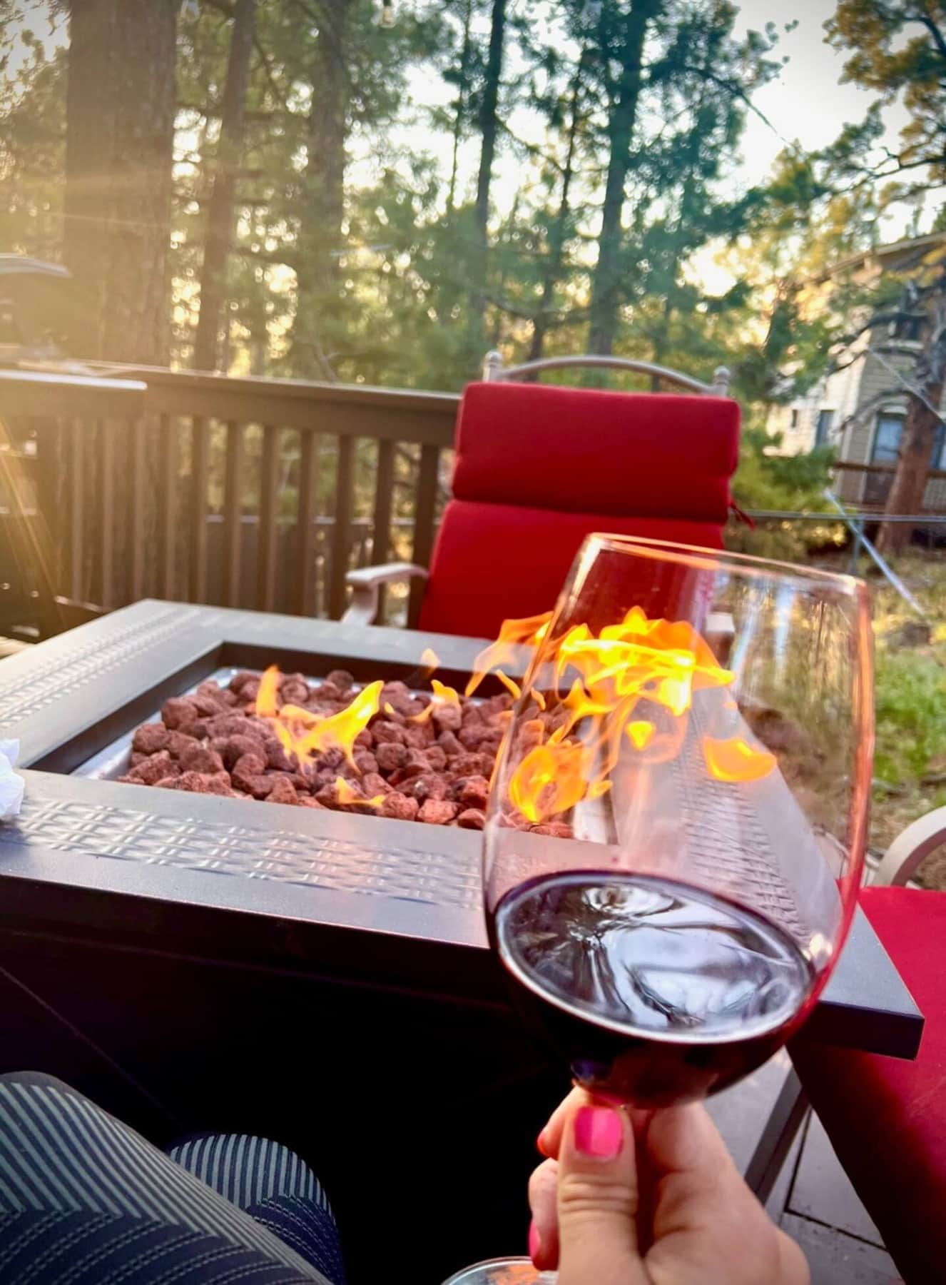 Evening wine by the fire pit at cozy Munds Park cabin