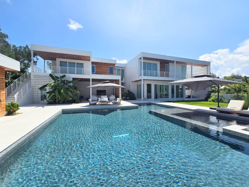 Luxury Siesta Key home backyard view of the large sized saltwater pool