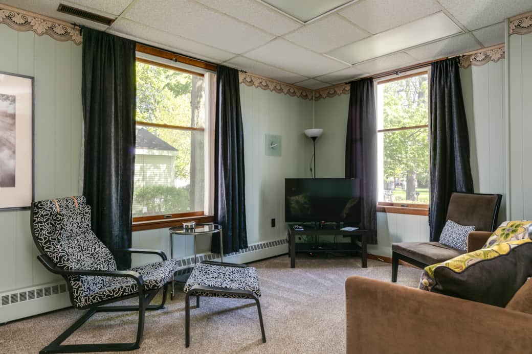 Relax in our comfy living area with view of the park